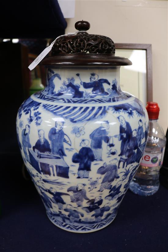 A Chinese blue and white Hundred Boys vase, Transitional period c. 1640, wood stand and cover